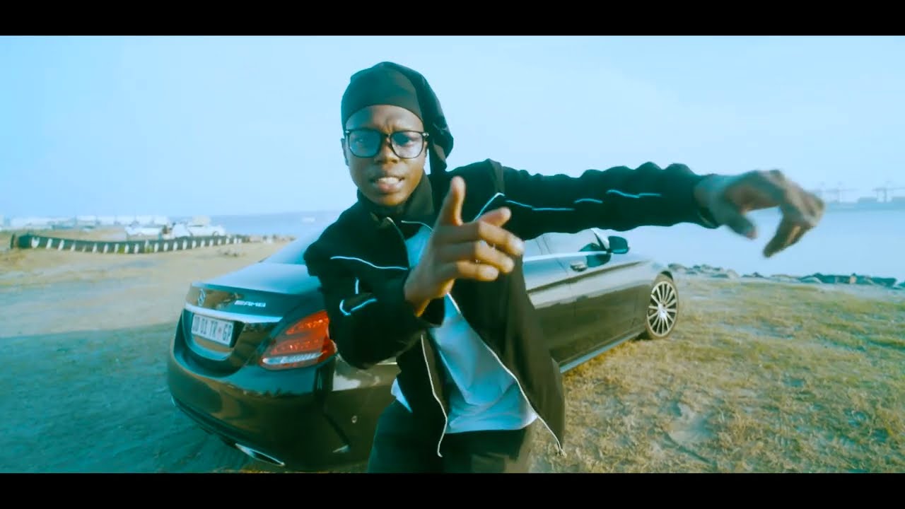 Tame Tiger performing beside a car in the Another One music video